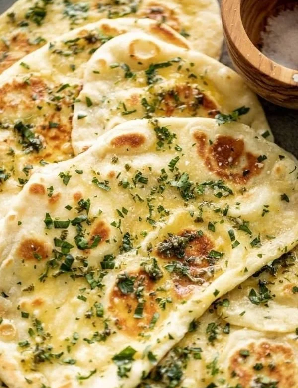 Freshly baked Garlic Naan Bread with herbs and spices