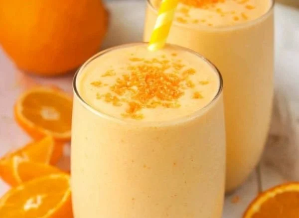 Delicious Orange Creamsicle Smoothie in a glass with orange slices