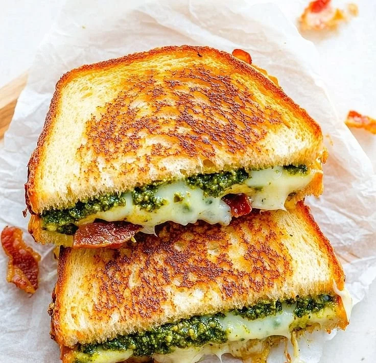 Pesto Grilled Cheese sandwich with melted cheese and fresh pesto sauce