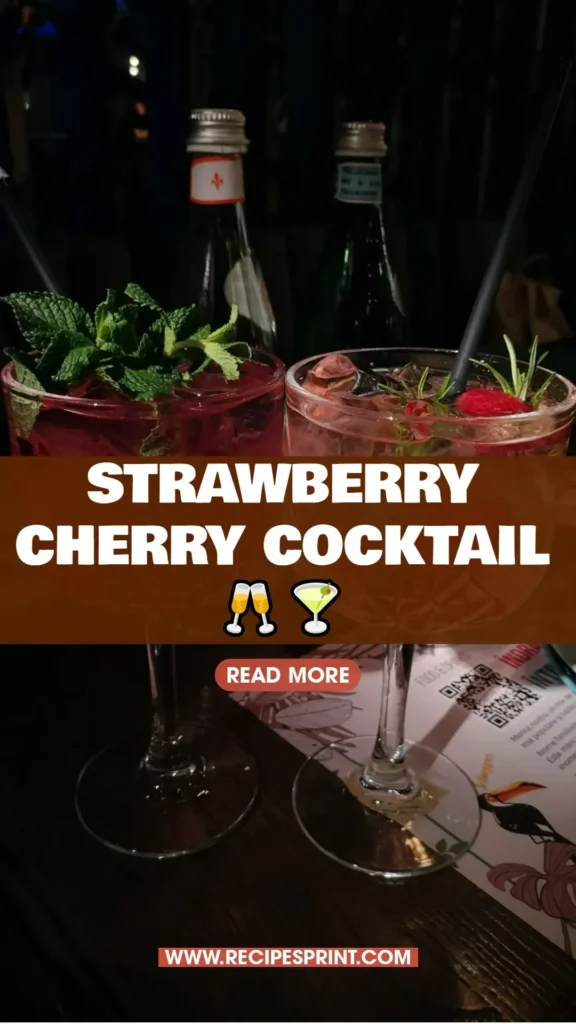 Delicious strawberry cherry cocktail garnished with fresh fruit.