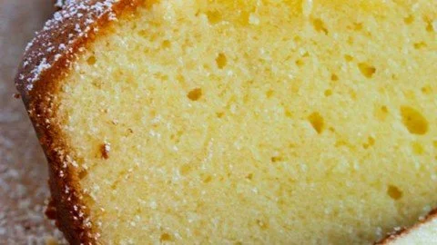 A deliciously moist slice of cream cheese pound cake on a decorative plate