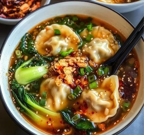 Bowl of homemade easy dumpling soup with fresh ingredients