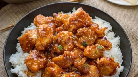 Delicious General Tso's Chicken served with vegetables and rice