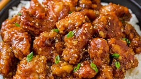 Delicious General Tso's Chicken served with broccoli and rice