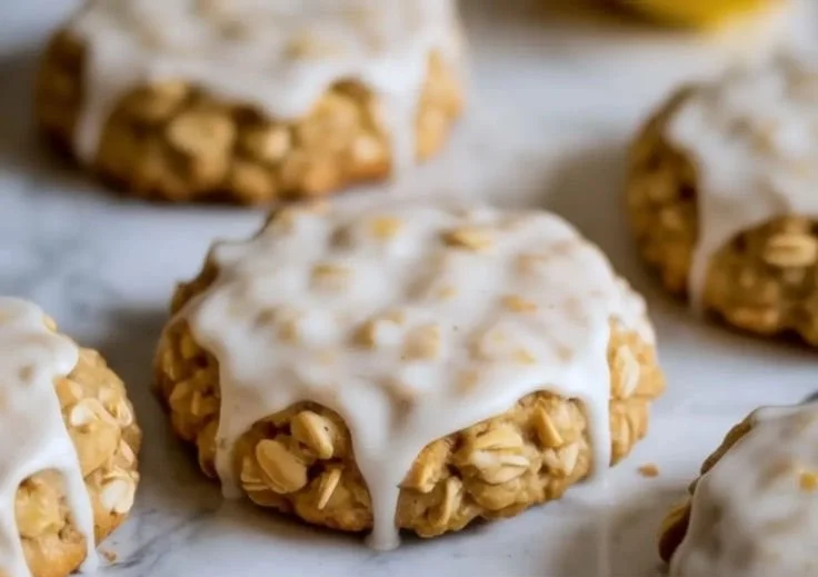 Lemon oatmeal cookies on a plate with fresh lemon slices