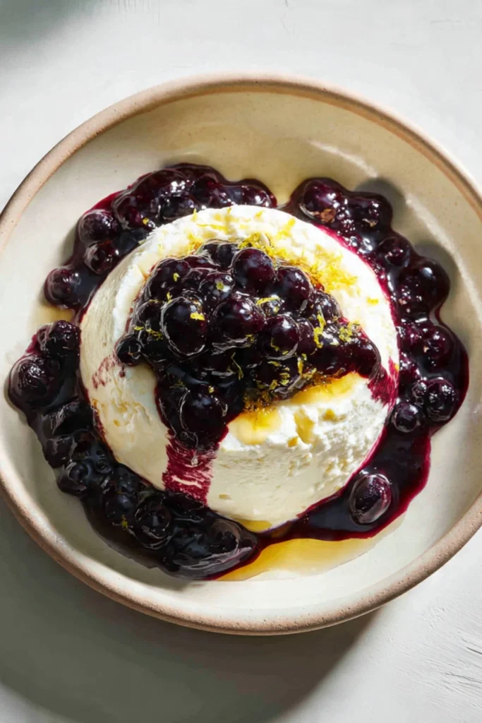 Lemon-Olive Oil Semifreddo served with blueberry compote in a dessert bowl