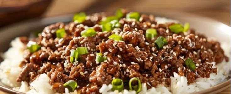 Plate of Mongolian Ground Beef served with vegetables and rice