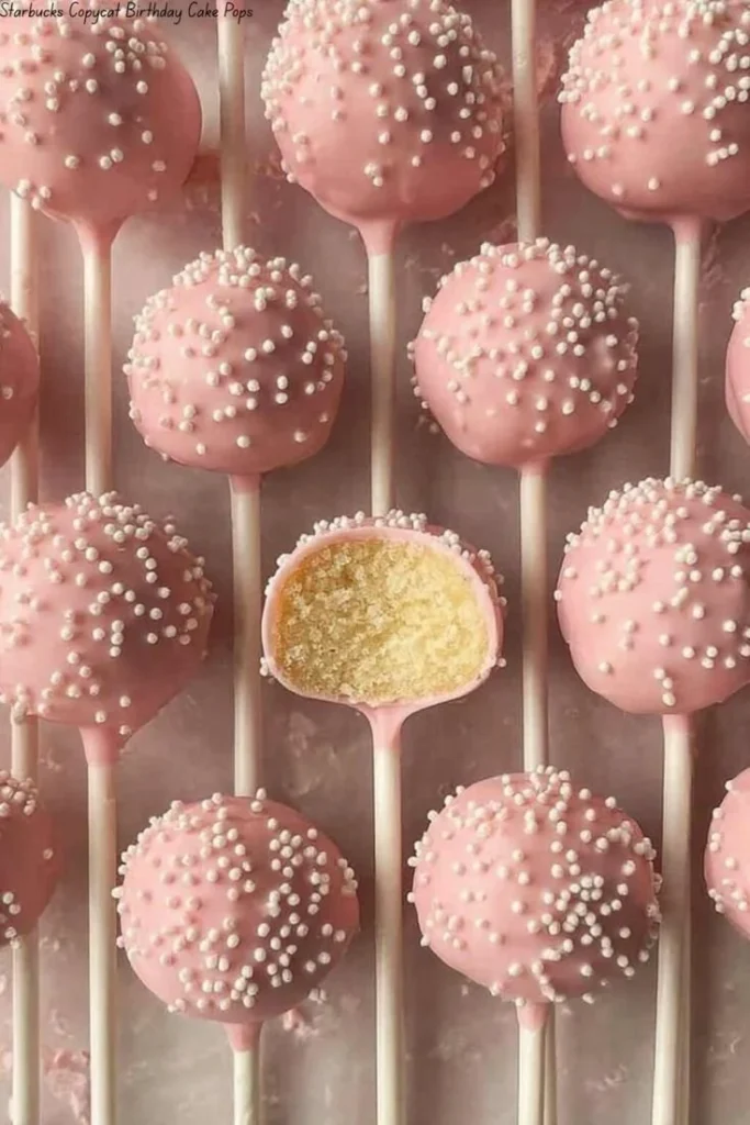 Starbucks copycat birthday cake pops decorated with colorful sprinkles.