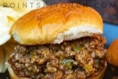 Weight Watchers cheesesteak sloppy joes on a plate with toppings