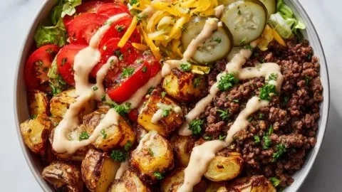 Delicious burger bowls served with crispy potatoes and fresh toppings