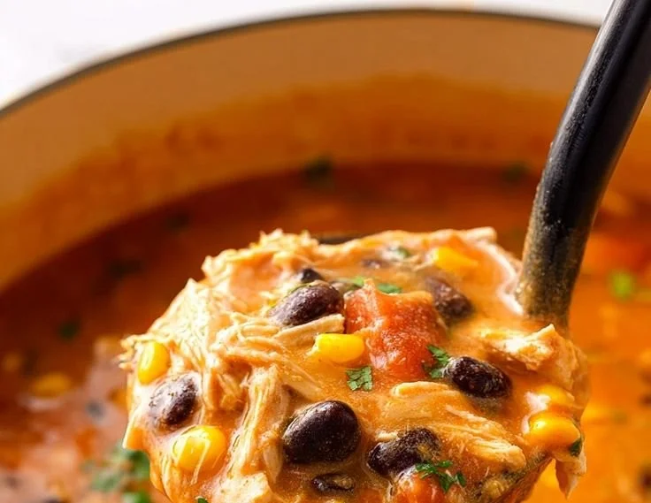 Bowl of Classic Chicken Tortilla Soup topped with tortilla strips and cilantro