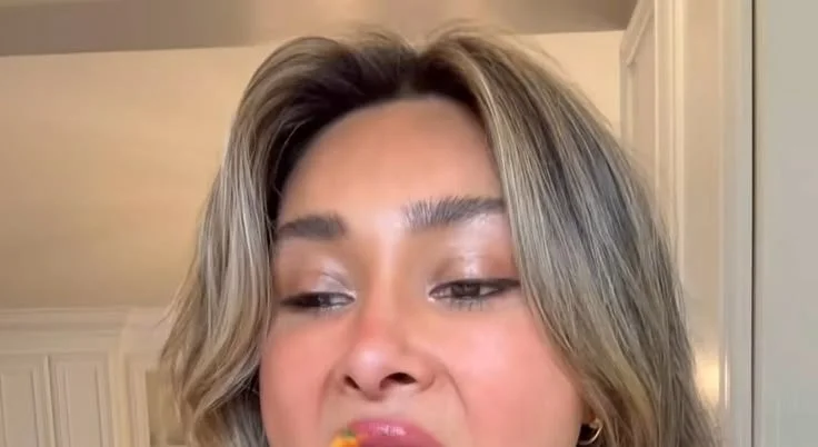 Bowl of crunchy carrot salad with fresh ingredients and a vibrant presentation