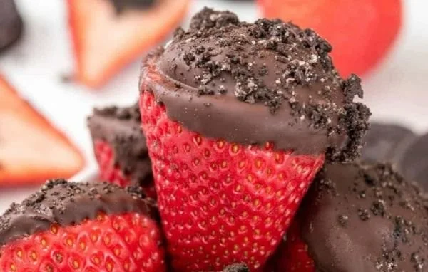 Oreo truffle-stuffed strawberries arranged on a platter