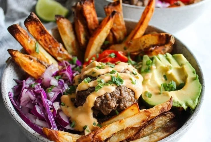 Whole30 burger bowls featuring crispy fries and fresh toppings