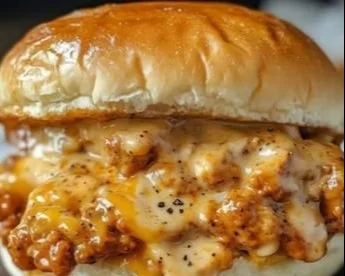 Cajun Chicken Sloppy Joes served on a plate with fresh toppings