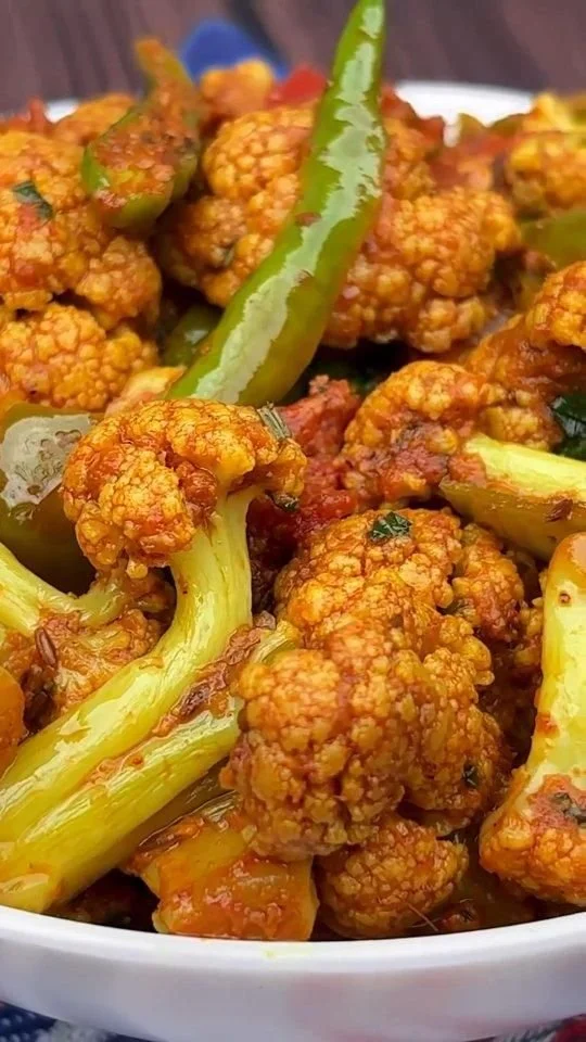 Bowl of delicious Cauliflower Masala Dry with spices and herbs