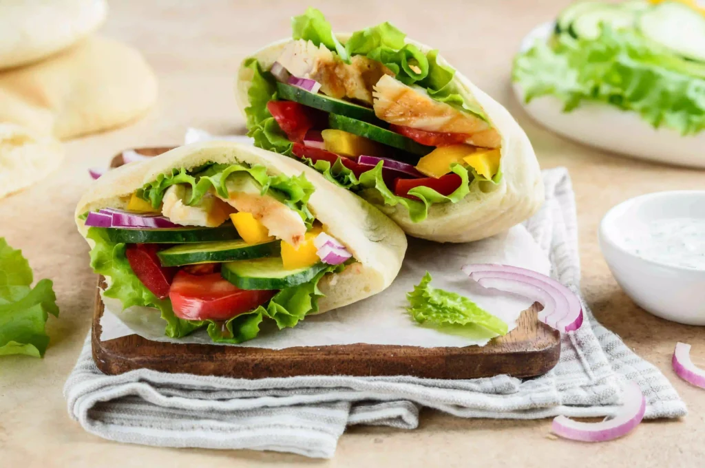 Delicious Chicken Pita Sandwich with fresh vegetables and sauces