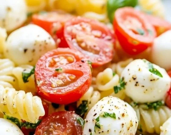 Creamy Caprese Pasta Salad with fresh mozzarella, tomatoes, and basil