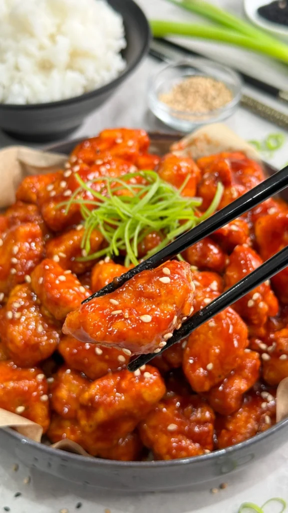 Healthy Korean Fried Chicken served on a plate with fresh vegetables
