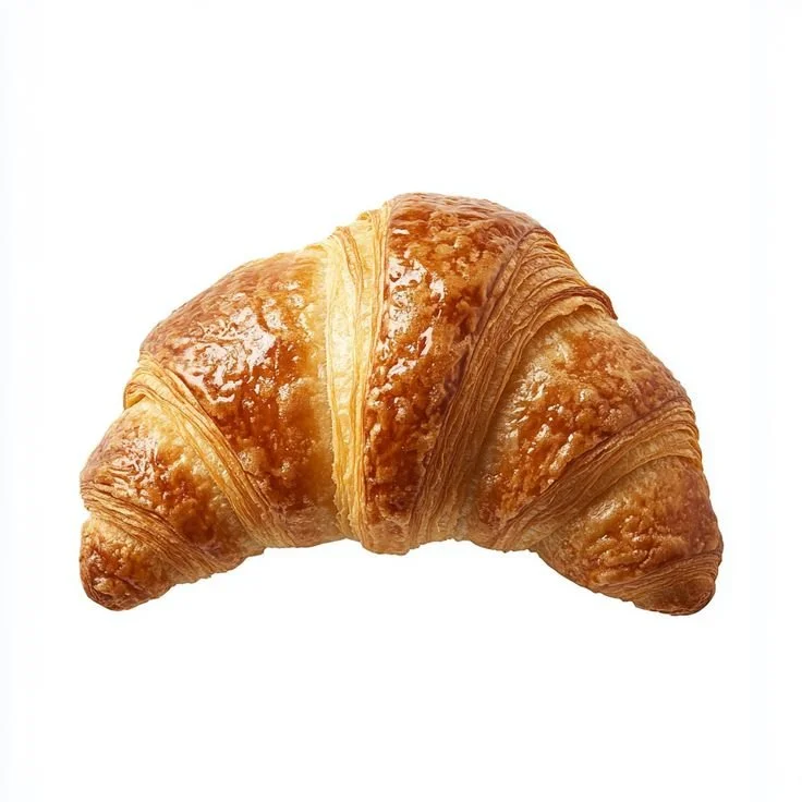 Variety of popular French sweets including macarons and éclairs on a dessert table.