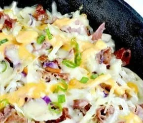 Delicious Reuben in a bowl with corned beef, sauerkraut, and dressing