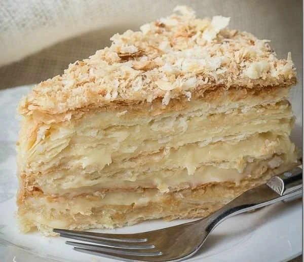 Russian Napoleon Cake with layers of creamy filling and flaky pastry
