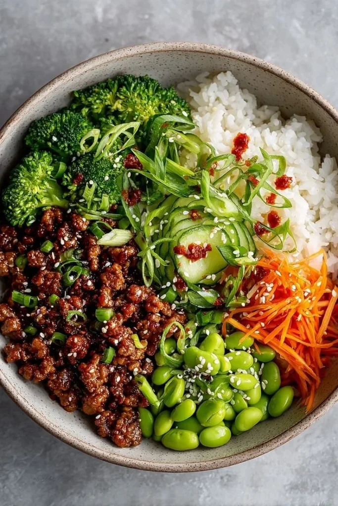 A tasty Teriyaki Turkey Rice Bowl garnished with fresh vegetables