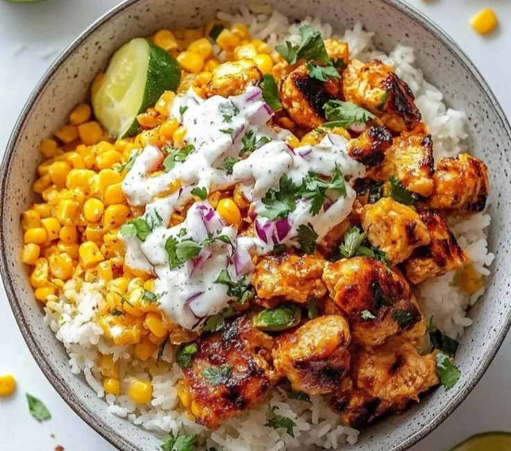 Colorful chicken rice bowl with tender chicken and fresh veggies