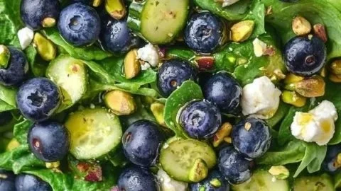 Blueberry Pistachio Spring Salad with greens, blueberries, and nuts