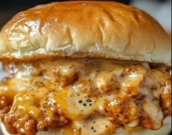 Cajun Chicken Sloppy Joes served on a plate with fresh ingredients