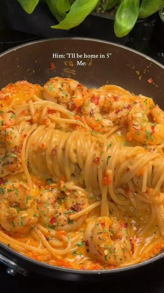 Delicious Cajun Shrimp Pasta garnished with herbs and spices