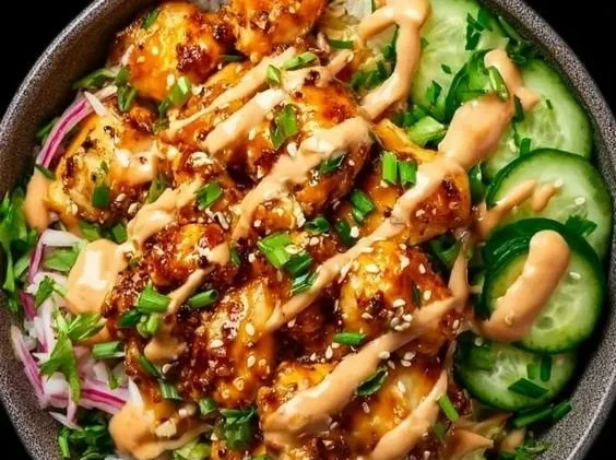 Crispy chicken served with a creamy spicy sauce on a plate