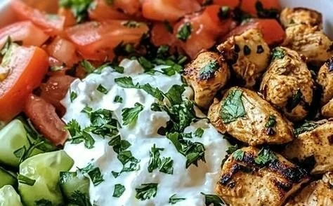 Delicious Greek Chicken Gyro Bowl with fresh ingredients and tzatziki sauce.