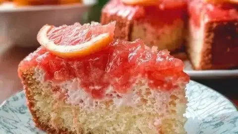 Delicious Hawaiian Guava Cake topped with fresh guava slices and cream