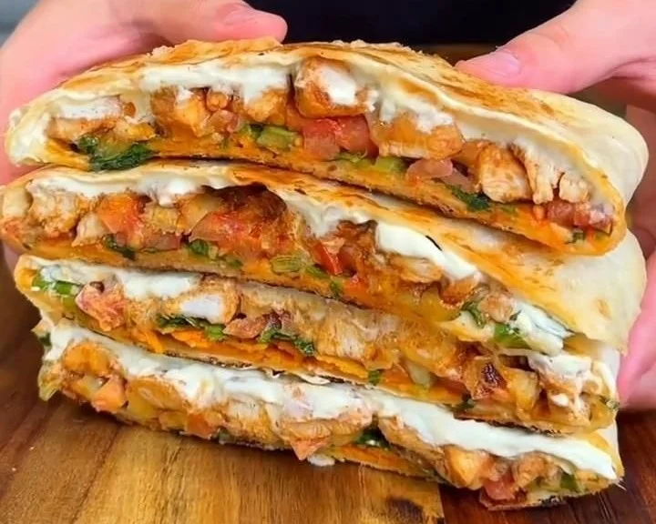 High Protein Chicken Crunch Wrap Supreme filled with fresh ingredients and flavors.
