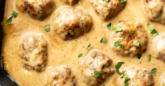 Delicious homemade IKEA meatballs served with gravy and lingonberry sauce
