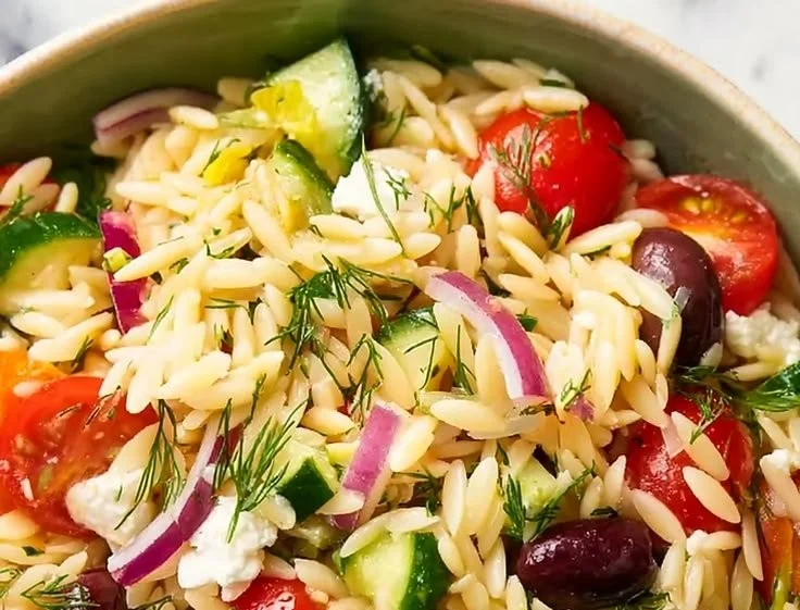 Colorful Mediterranean Orzo Pasta Salad with fresh vegetables and herbs