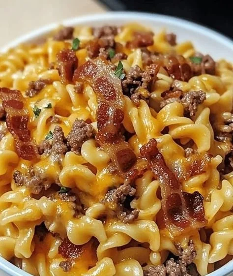 Delicious loaded bacon cheeseburger pasta topped with cheese and bacon