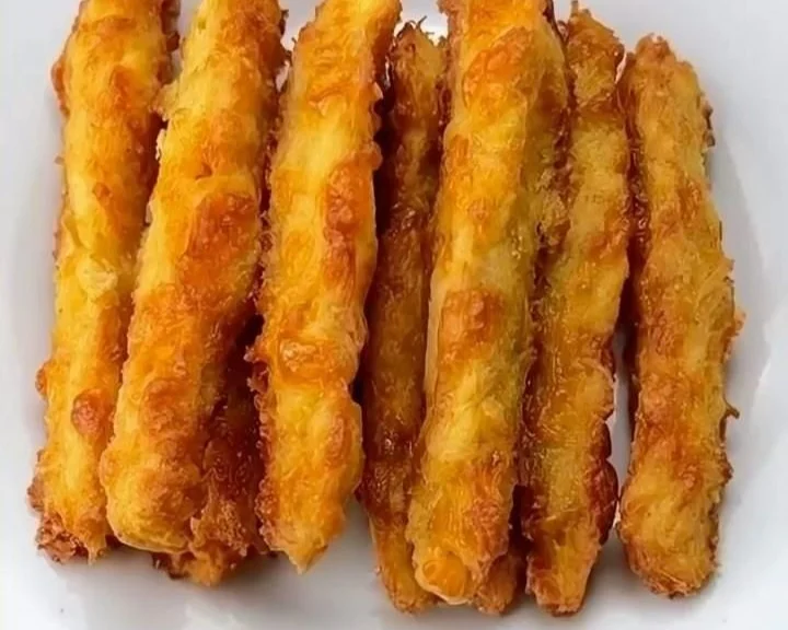 Plate of low-carb chicken fries served with dipping sauce.