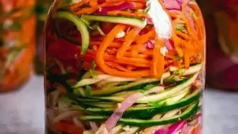 Colorful quick fridge pickled vegetables in jars for a tangy crunchy snack