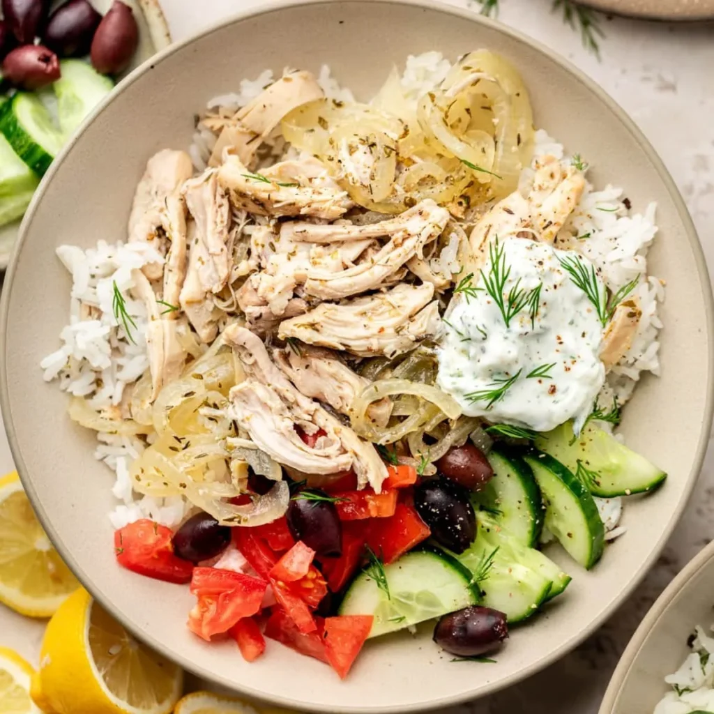 Delicious Slow Cooker Greek Chicken served with herbs and lemon