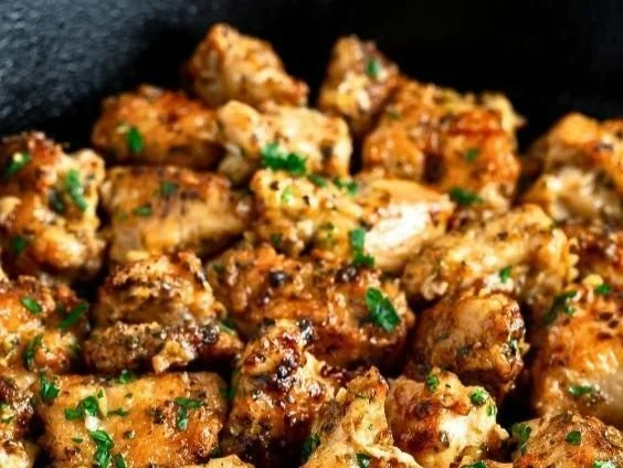 Bite-sized succulent chicken breast morsels seared to perfection, showcasing delicious flavor.