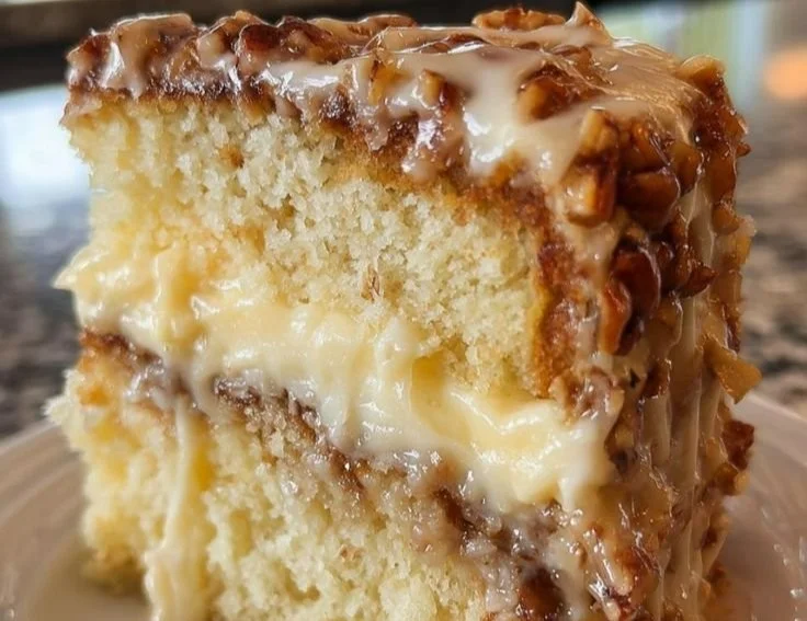 Slice of White German Chocolate Cake with coconut and pecan frosting